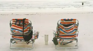 Two beach chairs on Siesta Key beach at sunrise, showing a relaxed first-day setup for first time visiting Siesta Key travel planning