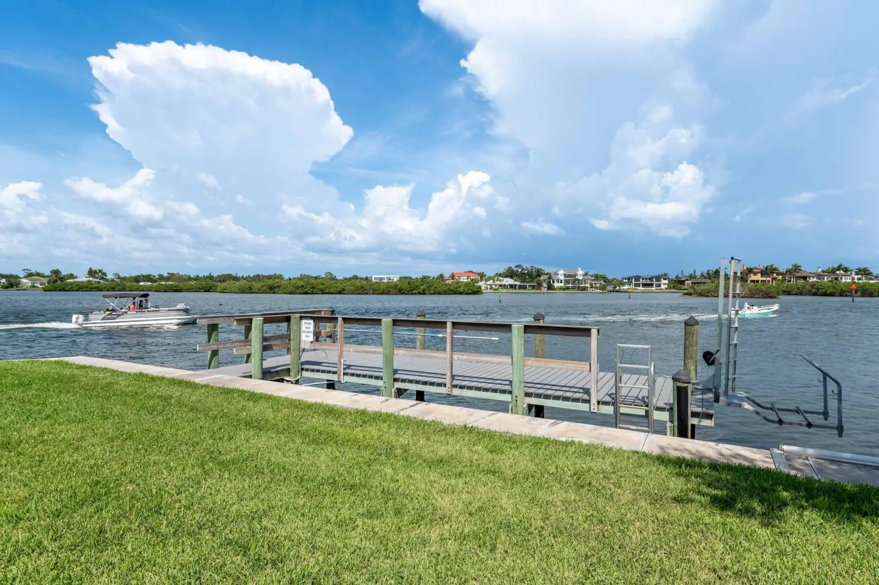 Bay dock and water view on Siesta Key, Florida — easy bay access for Provincial Gardens beach-to-bay stays