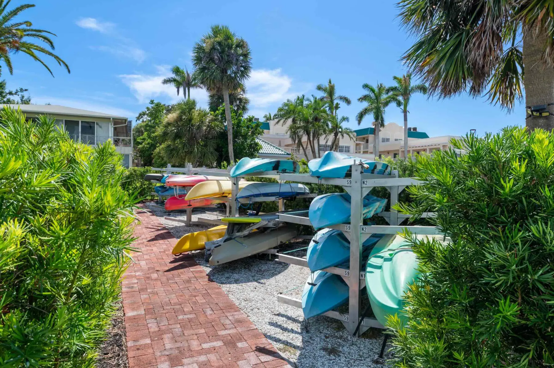 Kayak storage rack on Siesta Key, Florida — bay paddling access available via shared Aloha Kai amenities for Provincial Gardens guests