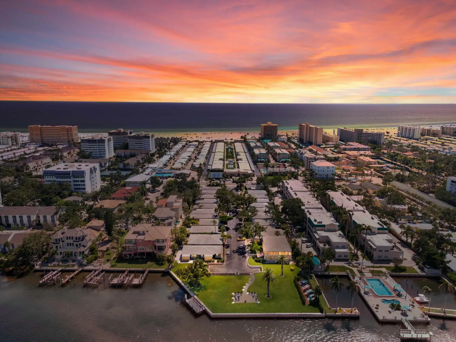 Aerial sunset over Siesta Key, Florida — scenic setting that surrounds Provincial Gardens vacation rentals