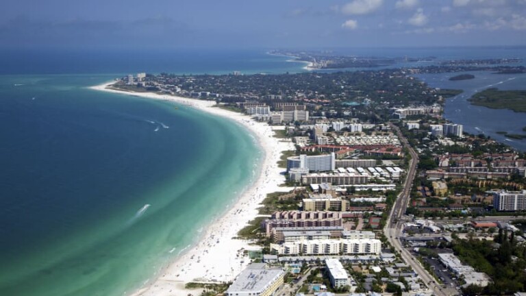 Aerial view of Siesta Key Beach and the island shoreline in Siesta Key, Florida, showing the main stay zones for this where to stay on Siesta Key guide